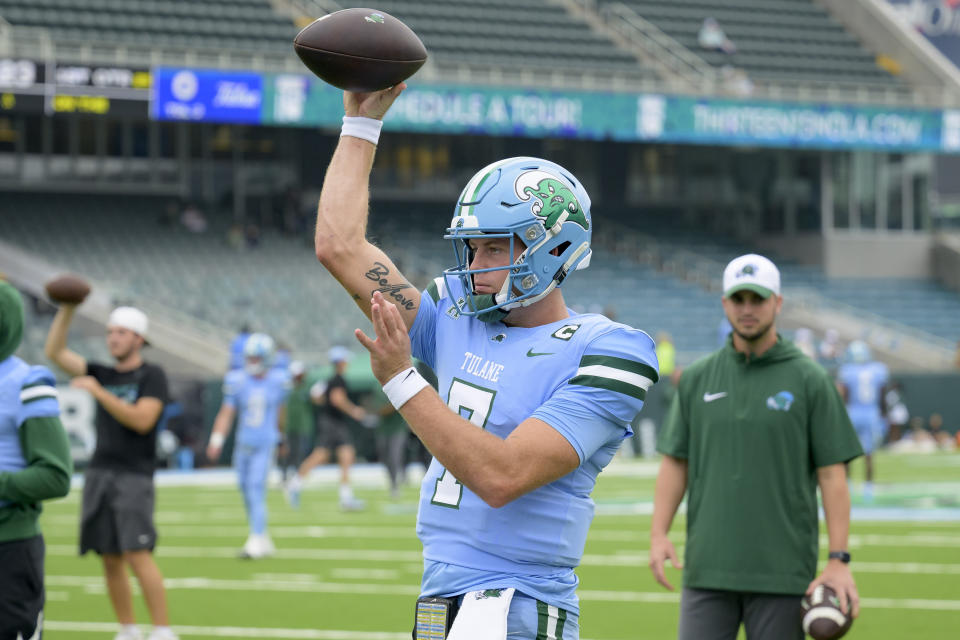 Tulane quarterback Michael Pratt (7) warms up before an NCAA college football game against Tulsa in New Orleans, Saturday, Nov. 11, 2023. (AP Photo/Matthew Hinton)