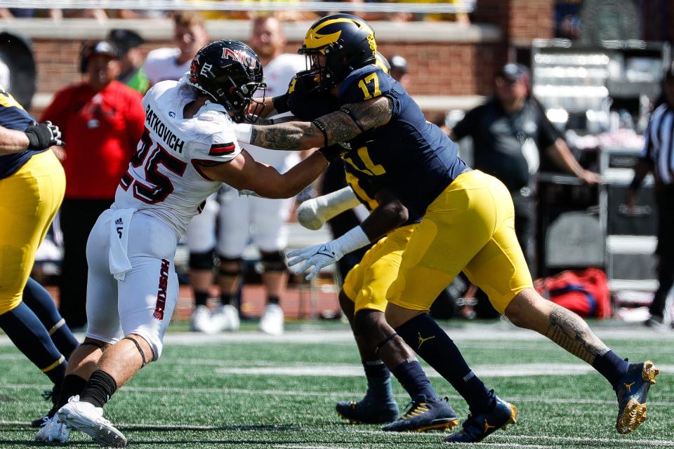 Michigan defensive end Braiden McGregor (17) rushes against Northern Illinois during a game at Michigan Stadium in Ann Arbor on Saturday, Sept. 18, 2021.