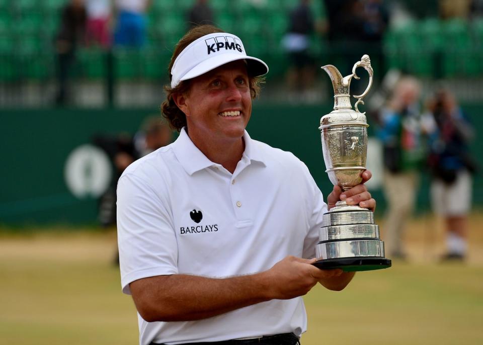 Phil Mickelson celebrated with the Claret Jug after winning the 2013 Open Championship (Owen Humphreys/PA) (PA Archive)