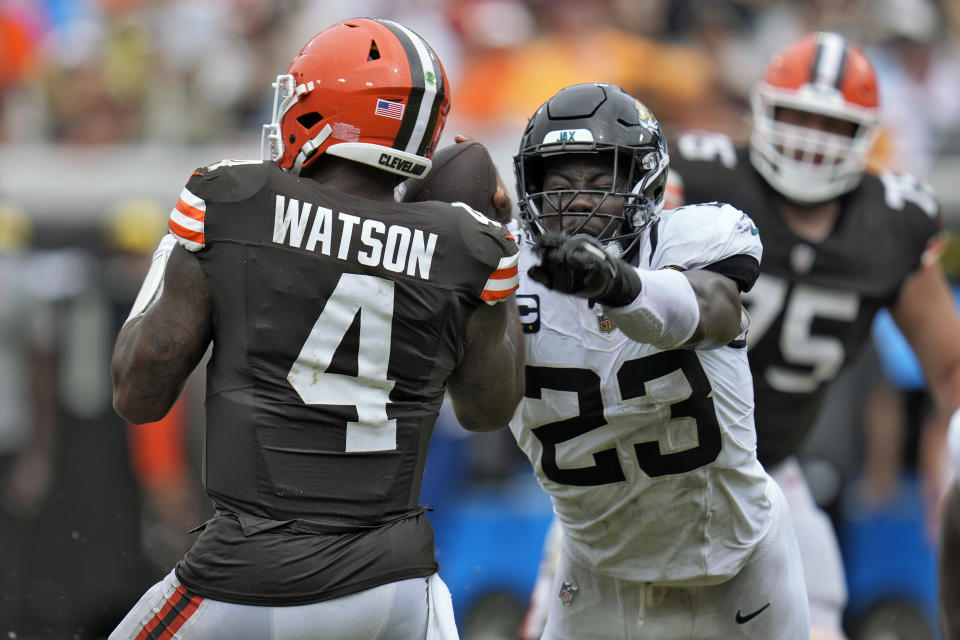 Jacksonville Jaguars linebacker Foyesade Oluokun (23) saks Cleveland Browns quarterback Deshaun Watson (4) during the second half of an NFL football game Sunday, Sept. 15, 2024, in Jacksonville, Fla. (AP Photo/John Raoux)