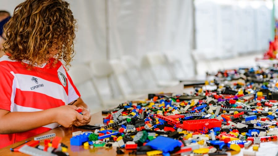 A child plays with LEGO bricks in the center of Solvang, California during the annual Danish Days celebration in September 2022. (Deborah Chadsey Photography)