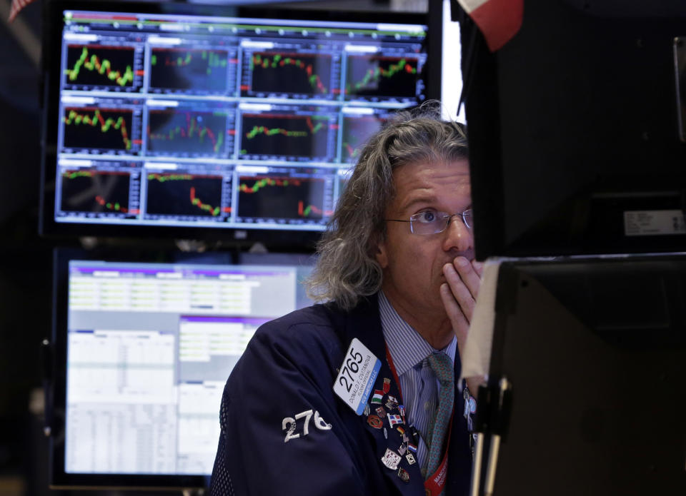 Specialist Donald Civitanova works on the floor of the New York Stock Exchange Thursday, Jan. 23, 2014. U.S. stocks are falling broadly in morning trading Thursday as investors weigh some disappointing earnings from U.S. companies and a survey from China suggesting the manufacturing sector of the world's second-largest economy is headed for a contraction. (AP Photo/Richard Drew)