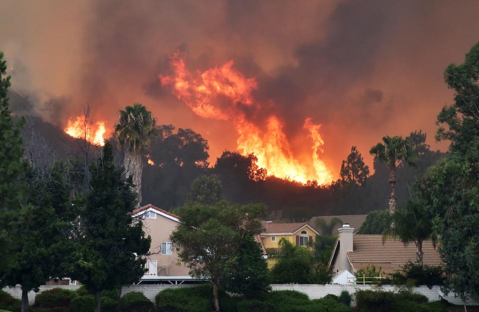 Firefighters battle raging Southern California wildfire