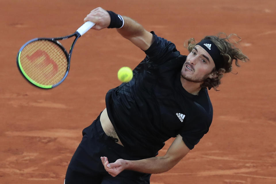 Greece's Stefanos Tsitsipas serves against Slovenia's Aljaz Bedene in the third round match of the French Open tennis tournament at the Roland Garros stadium in Paris, France, Saturday, Oct. 3, 2020. (AP Photo/Michel Euler)