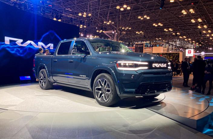 Wide shot of a blue 2024 Ram 1500 REV electric pickup truck at the New York Auto Show.