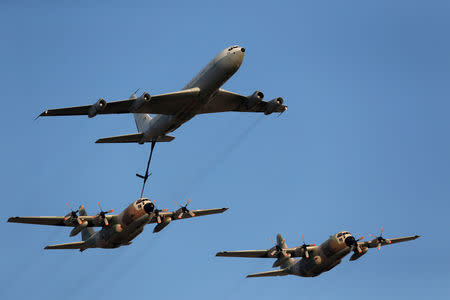 FILE PHOTO: An Israeli Air Force C-130 Hercules is refuelled by a Boeing 707 (top) during an aerial demonstration at a graduation ceremony for Israeli airforce pilots at the Hatzerim air base in southern Israel June 30, 2016. REUTERS/Amir Cohen/File Photo