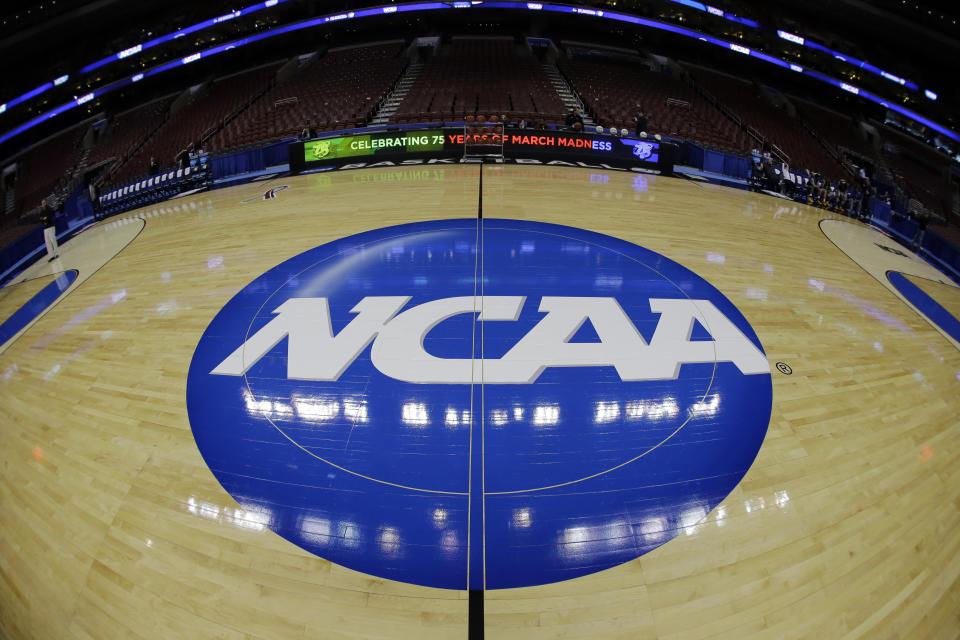 The NCAA logo is shown before Albany’s practice for a second-round game of the NCAA college basketball tournament, Thursday, March 21, 2013, in Philadelphia. (AP Photo/Matt Slocum)