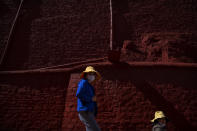 Tourists walk down a flight of steps at the Potala Palace in Lhasa in western China's Tibet Autonomous Region, Tuesday, June 1, 2021. Tourism is booming in Tibet as more Chinese travel in-country because of the coronavirus pandemic, posing risks to the region's fragile environment and historic sites. (AP Photo/Mark Schiefelbein)