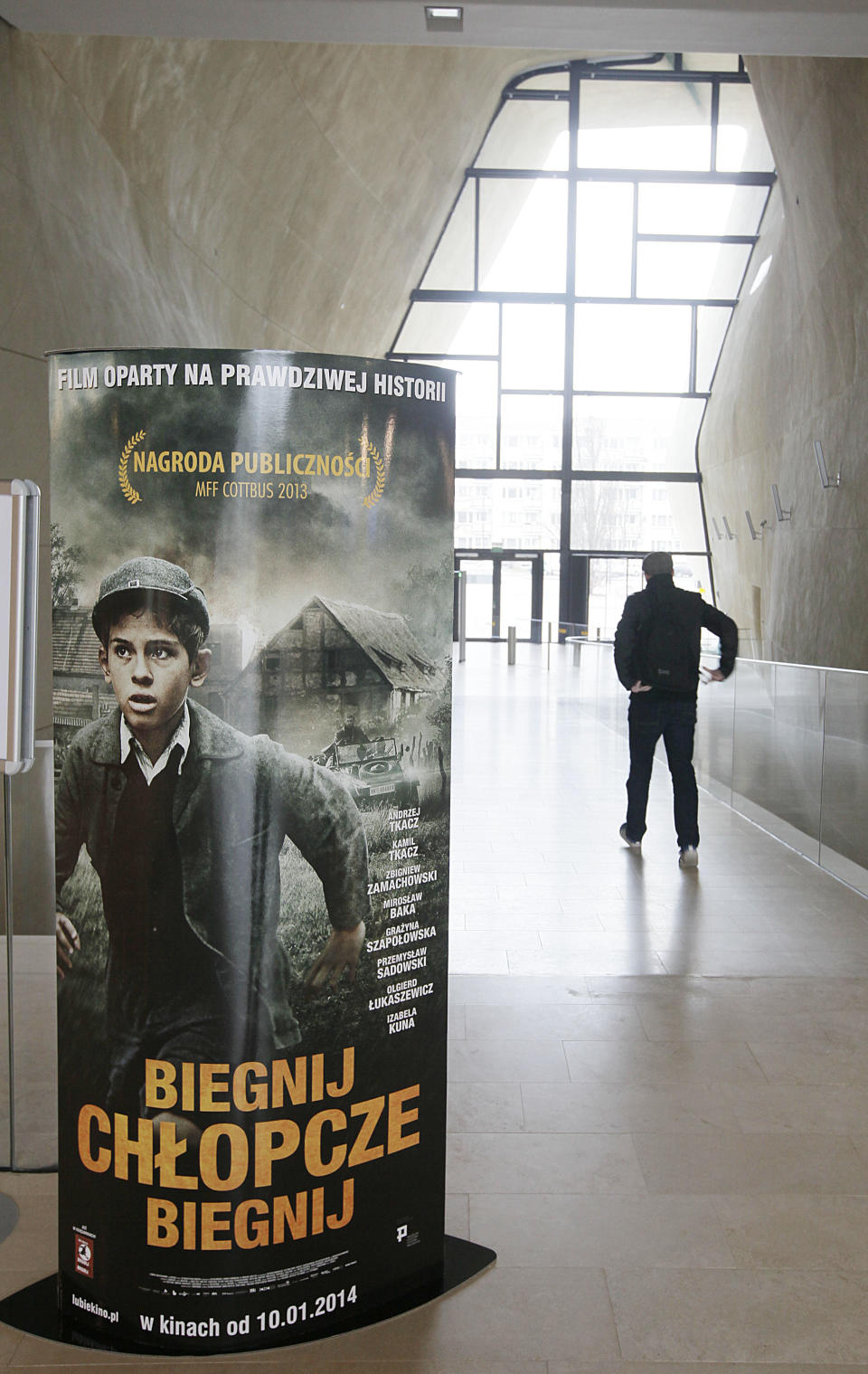 Posters advertising the movie "Run, Boy, Run" are displayed at the Museum of the History of Polish Jews prior to the world premiere of the movie by German Oscar-winning director Pepe Danquart about a Jewish boy struggling to survive the Holocaust, in Warsaw, Poland, Wednesday, Jan. 8, 2014. The movie is based on a true story of 10-year-old Yoram Friedman who escaped the Warsaw ghetto in 1943 and, hunted by the Nazis, hid in the woods near the city. (AP Photo/Czarek Sokolowski)