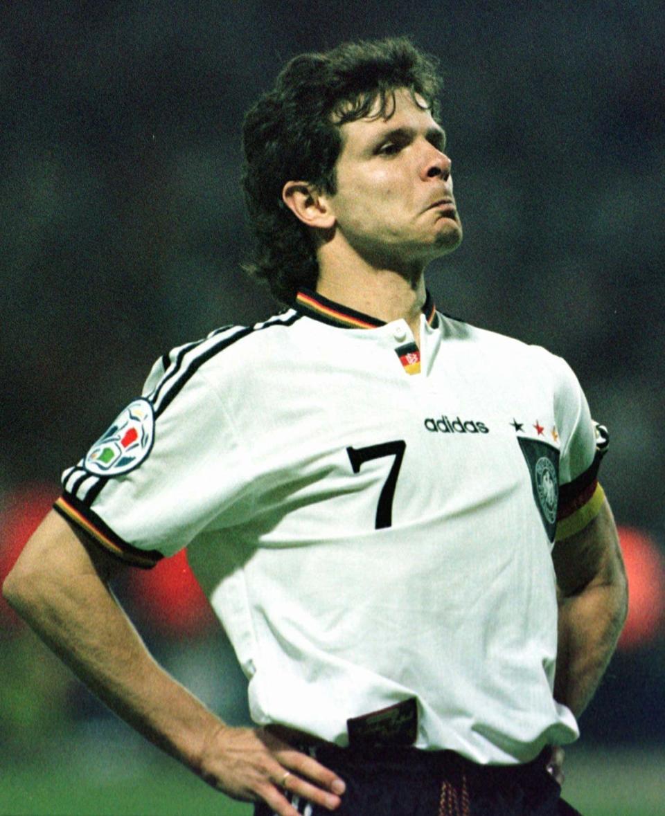 FILE - In this June 26, 1996 file photo Germany's Andreas Moeller, who scored the final penalty to give his team a 6-5 victory in a penalty shoot-out over England, reacts towards the crowd a penalty shootout in the European Soccer Championships semi-final match against England at London's Wembley Stadium. Germany won 6-5 on penalties after the match finished 1-1 following extra time. (AP Photo/Michael Probst, File)