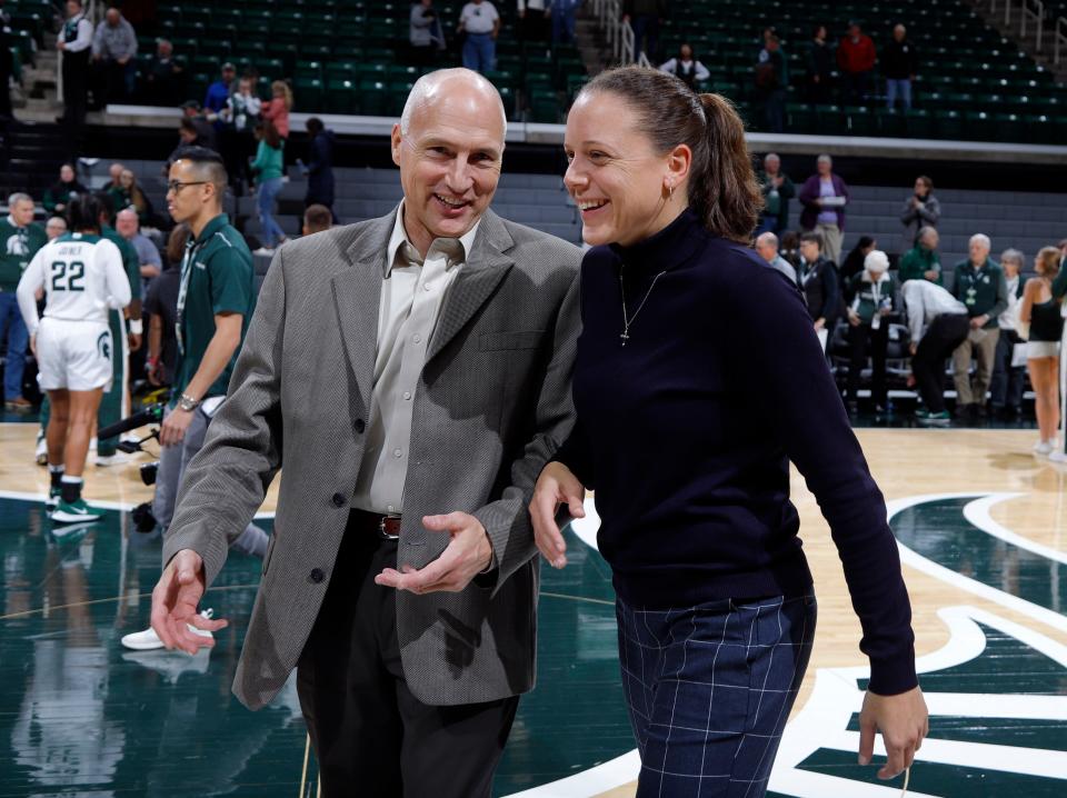 New Michigan State assistant coaches Dean Lockwood and Kristin Haynie talk after their exhibition game against Ferris State Wednesday, Oct. 30, 2019, in East Lansing, Mich. Michigan State won 85-45.