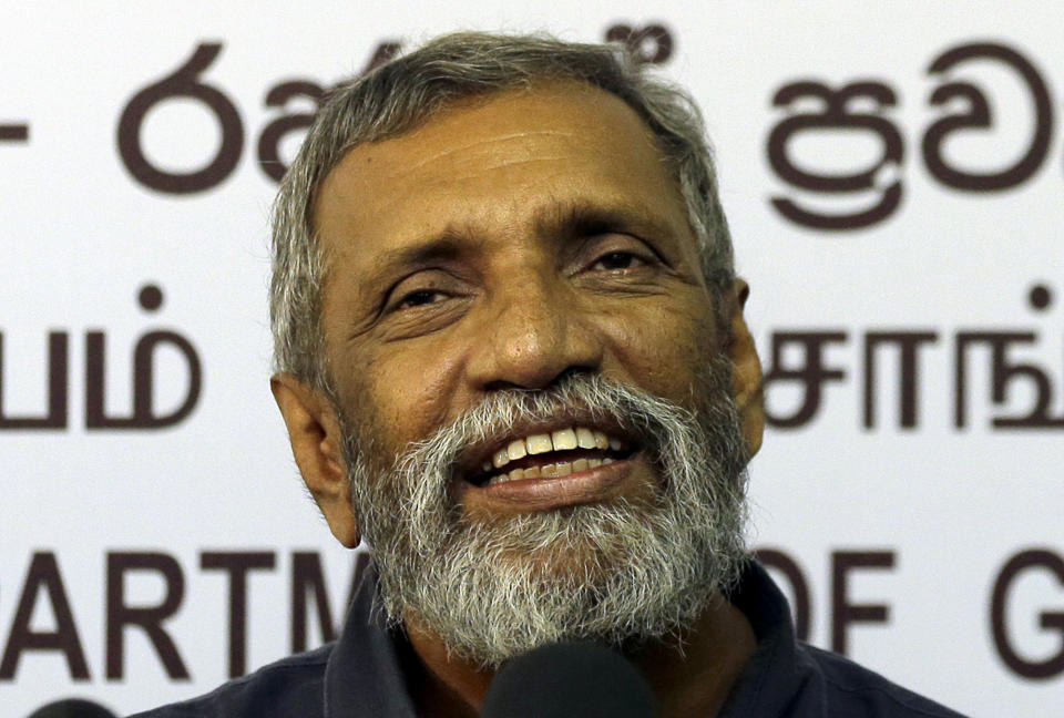 Sri Lanka's elections chief Mahinda Deshapriya speaks during a press conference in Colombo, Sri Lanka, Wednesday, Oct. 16, 2019. Deshapriya says he has asked for an explanation from the defense ministry on why the army commander features in an advertisement promoting a candidate for next month's presidential election. The advertisement, which appeared in a newspaper last weekend, had comments made by Lt. Gen. Shavendra Silva, the current army chief, in 2009 praising presidential candidate Gotabaya Rajapaksa for his role in ending the country's long civil war. (AP Photo/Eranga Jayawardena)