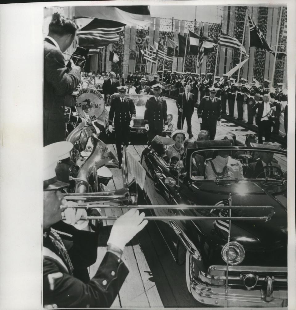 A Marine Corps band plays as Britain's Queen Elizabeth rides near the entrance to Chicago's International Trade Fair on July 6, 1959. The fair was one of several stops the British monarch made that day; at a reception with Midwestern governors and mayors later that day, the queen and Prince Philip met Milwaukee Mayor Frank Zeidler.