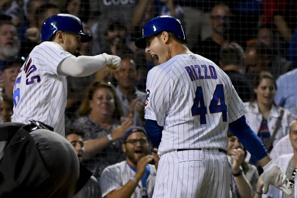 Chicago Cubs' Anthony Rizzo (44) celebrates with Nicholas Castellanos, left, after Rizzo hit a home run against the St. Louis Cardinals during the third inning of a baseball game Thursday, Sept. 19, 2019, in Chicago. (AP Photo/Matt Marton)