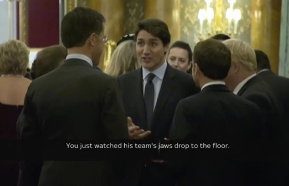 In this grab taken from video on Tuesday, Dec. 3, 2019, Canada's Prime Minister Justin Trudeau, centre, gestures as he speaks during a NATO reception. While NATO leaders are professing unity as they gather for a summit near London, several seem to have been caught in an unguarded exchange on camera apparently gossiping about U.S. President Donald Trump’s behavior. In footage recorded during a reception at Buckingham Palace on Tuesday, Canadian Prime Minister Justin Trudeau was seen standing in a huddle with French President Emmanuel Macron, British Prime Minister Boris Johnson, Dutch Prime Minister Mark Rutte and Britain’s Princess Anne. (Host Broadcaster via AP)