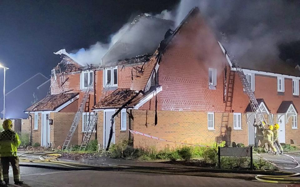 a mid-terraced house in a genteel suburb went up in flames after being struck by lightning.