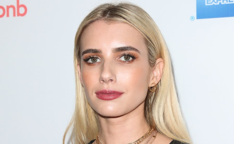 Emma Roberts makes shopping look so freaking chic in this all-black ensemble with leopard-print coat
