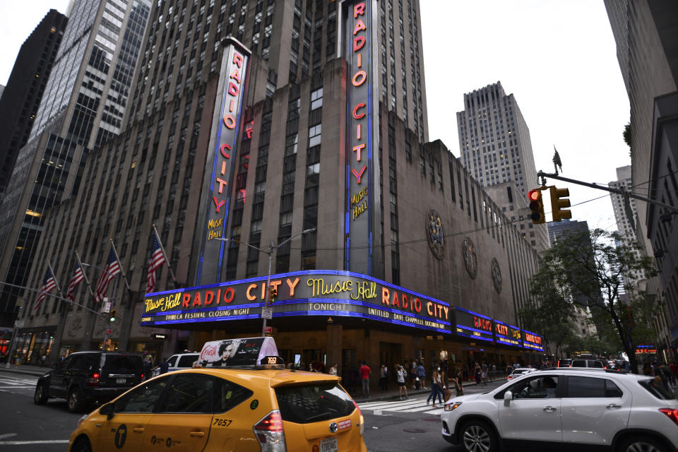 Radio City Music Hall's marquee advertises Dave Chappelle's untitled documentary during the closing night celebration for the 20th Tribeca Festival on Saturday, June 19, 2021, in New York. (Photo by Charles Sykes/Invision/AP)