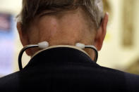 In this Tuesday, Oct. 30, 2012 photo, Dr. Russell Dohner wears a stethoscope around his neck as he tends to patients in his office in Rushville, Ill. When Dohner started practicing medicine in Rushville in 1955, he charged $2, the going rate around town for an office visit, but has since raised the fee to $5. (AP Photo/Jeff Roberson)