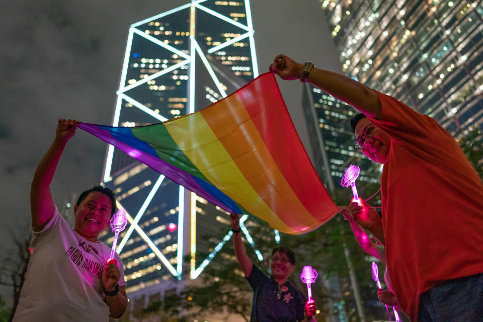 HONG KONG, HONG KONG - MAY 17: LGBT supporters hold a rainbow flag as they take part in a gathering for International Day Against Homophobia on May 17, 2019 in Hong Kong, China. Taiwan's parliament became the first in Asia to legalize same-sex marriage after lawmakers voted on Friday to allow same-sex couples full legal marriage rights, including areas in taxes, insurance and child custody.(Photo by Anthony Kwan/Getty Images)