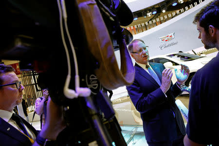 Cadillac President Johan de Nysschen (C) speaks to reporters during Auto China 2016 auto show in Beijing April 25, 2016. REUTERS/Damir Sagolj