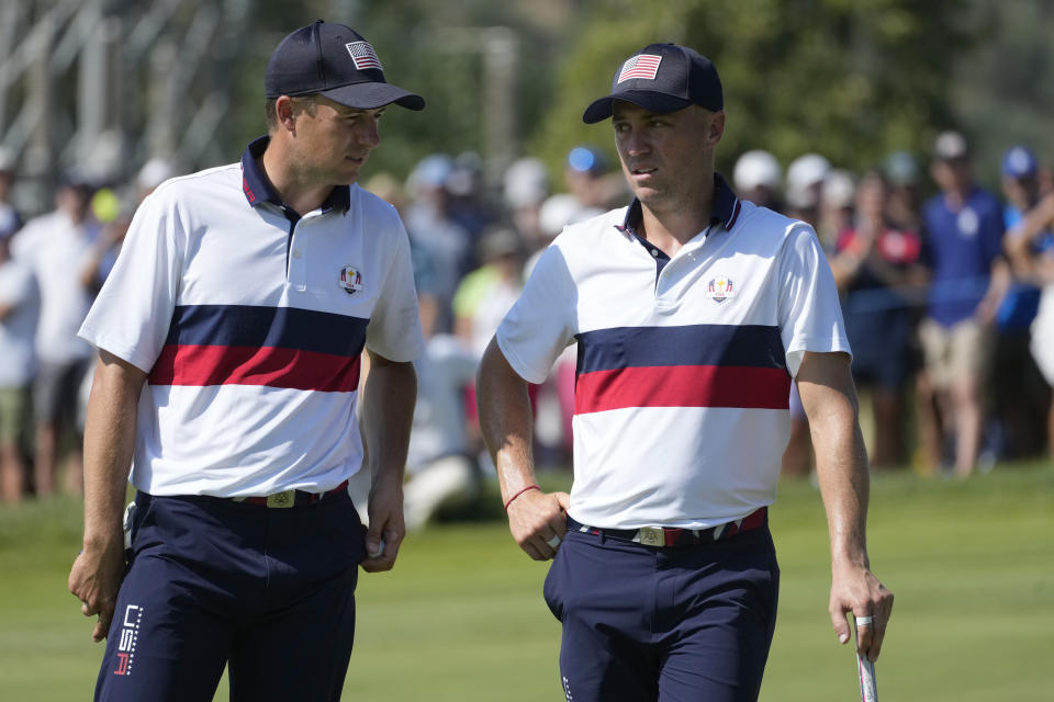 United States' Jordan Spieth, speaks to his playing partner United States' Justin Thomas on the 10th green during their afternoon Fourballs match at the Ryder Cup golf tournament at the Marco Simone Golf Club in Guidonia Montecelio, Italy, Saturday, Sept. 30, 2023. (AP Photo/Andrew Medichini)