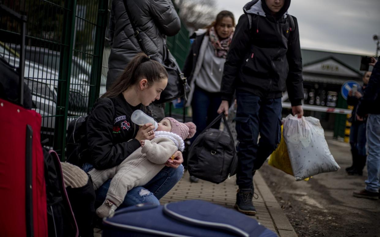 This young mother made it to safety with her baby at Ubla border crossing, Slovakia
