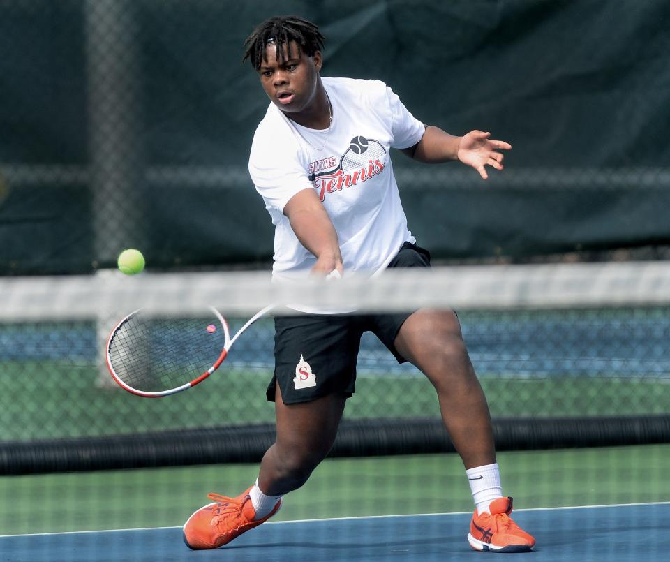 Springfield High School's Noah Williams returns a shot during the JD Sinnock Boys tennis tournament at the Velasco Tennis Center Friday, April 19, 2024.