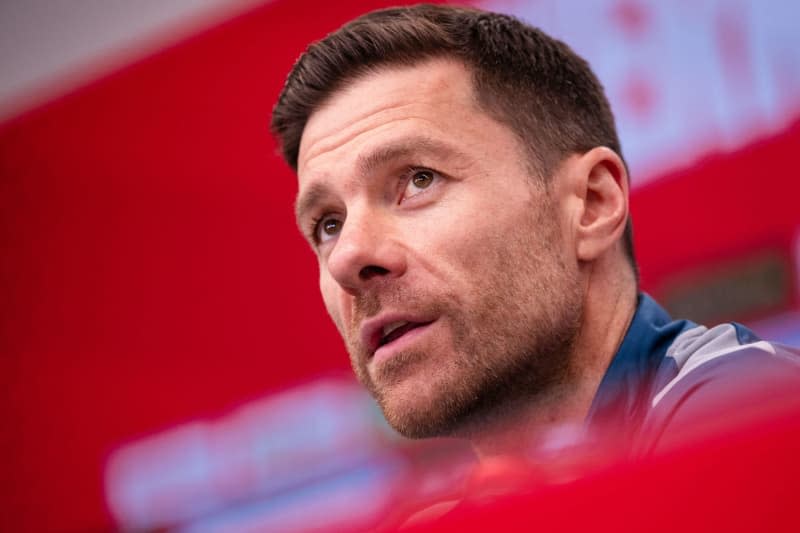Bayer Leverkusen coach Xabi Alonso speaks during a press conference ahead of Saturday's German Bundesliga soccer match against 1. FC Union Berlin. Alonso stressed his team is focused on the Europa League quarter-finals match against West Ham on 11 April as the club is on the verge of claiming their first-ever Bundesliga title. Marius Becker/dpa