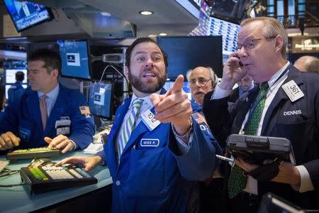 Traders work on the floor of the New York Stock Exchange March 17, 2015. REUTERS/Brendan McDermid