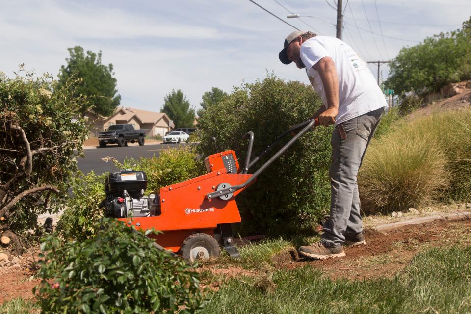 Washington City, Utah, residents replace grass as part of the statewide landscape conversion event Flip Blitz on Thursday.