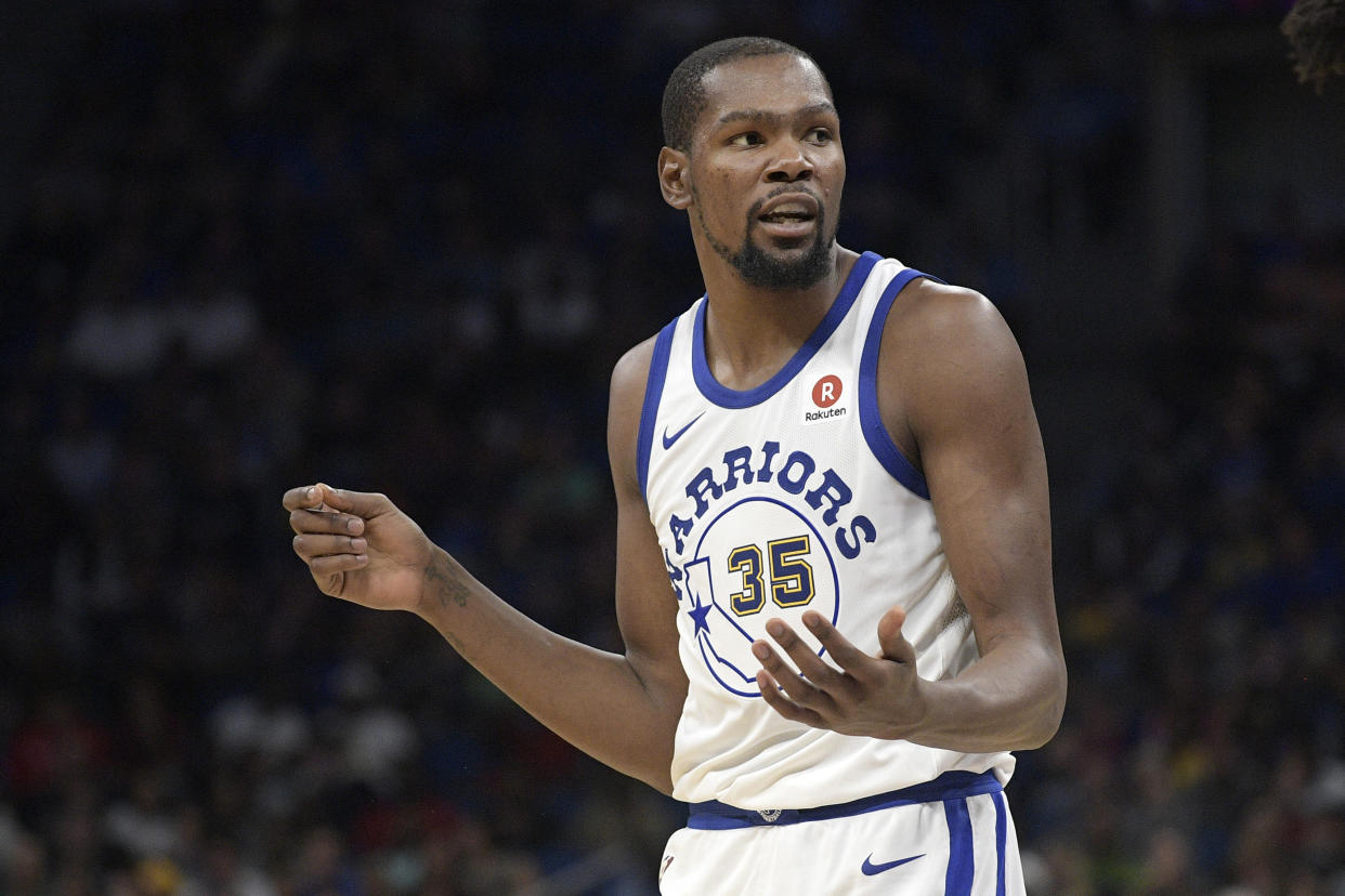 Kevin Durant watched the Warriors win from the locker room Friday night. (AP Photo/Phelan M. Ebenhack)