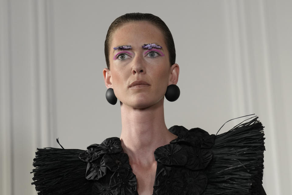 A model wears a creation for the Imane Ayissi Haute Couture Fall/winter 2023-2024 fashion collection presented in Paris, Thursday, July 6, 2023. (AP Photo/Christophe Ena)