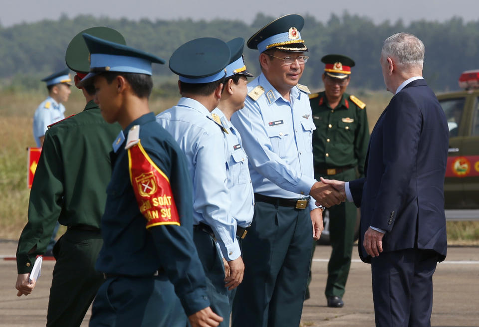 U.S. Secretary of Defense Jim Mattis, right, shakes hands with Vietnam's Air Force Deputy Commander Gen. Bui Anh Chung as he visits Bien Hoa airbase, where the U.S. army stored the defoliant Agent Orange during the Vietnam War, in Bien Hoa city, outside Ho Chi Minh city, Vietnam, Wednesday, Oct. 17, 2018. (Kham/Pool Photo via AP)