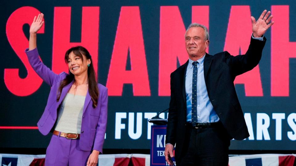 PHOTO: Presidential candidate Robert F. Kennedy Jr. waves on stage with Nicole Shanahan after announcing her as his running mate, during a campaign event, on March 26, 2024, in Oakland, Calif.  (Eric Risberg/AP)