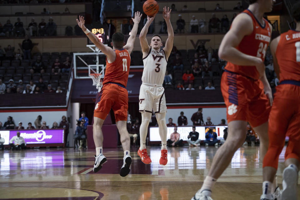 Virginia Tech's Sean Pedulla shoots over Clemson's Joseph Girard III during the first half of an NCAA college basketball game Wednesday, Jan. 10, 2024, in Blacksburg, Va. (AP Photo/Robert Simmons)