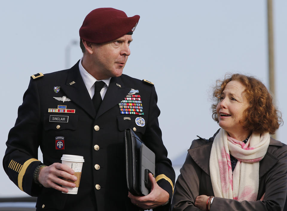 Brig. Gen. Jeffrey Sinclair, left, who admitted to inappropriate relationships with three subordinates, arrives at the courthouse for sentencing at Fort Bragg, N.C., Thursday, March 20, 2014 with attorney Ellen Brotman. Sinclair was reprimanded and docked $20,000 in pay Thursday, avoiding jail time in one of the U.S. military's most closely watched courts-martial. (AP Photo/Ellen Ozier)