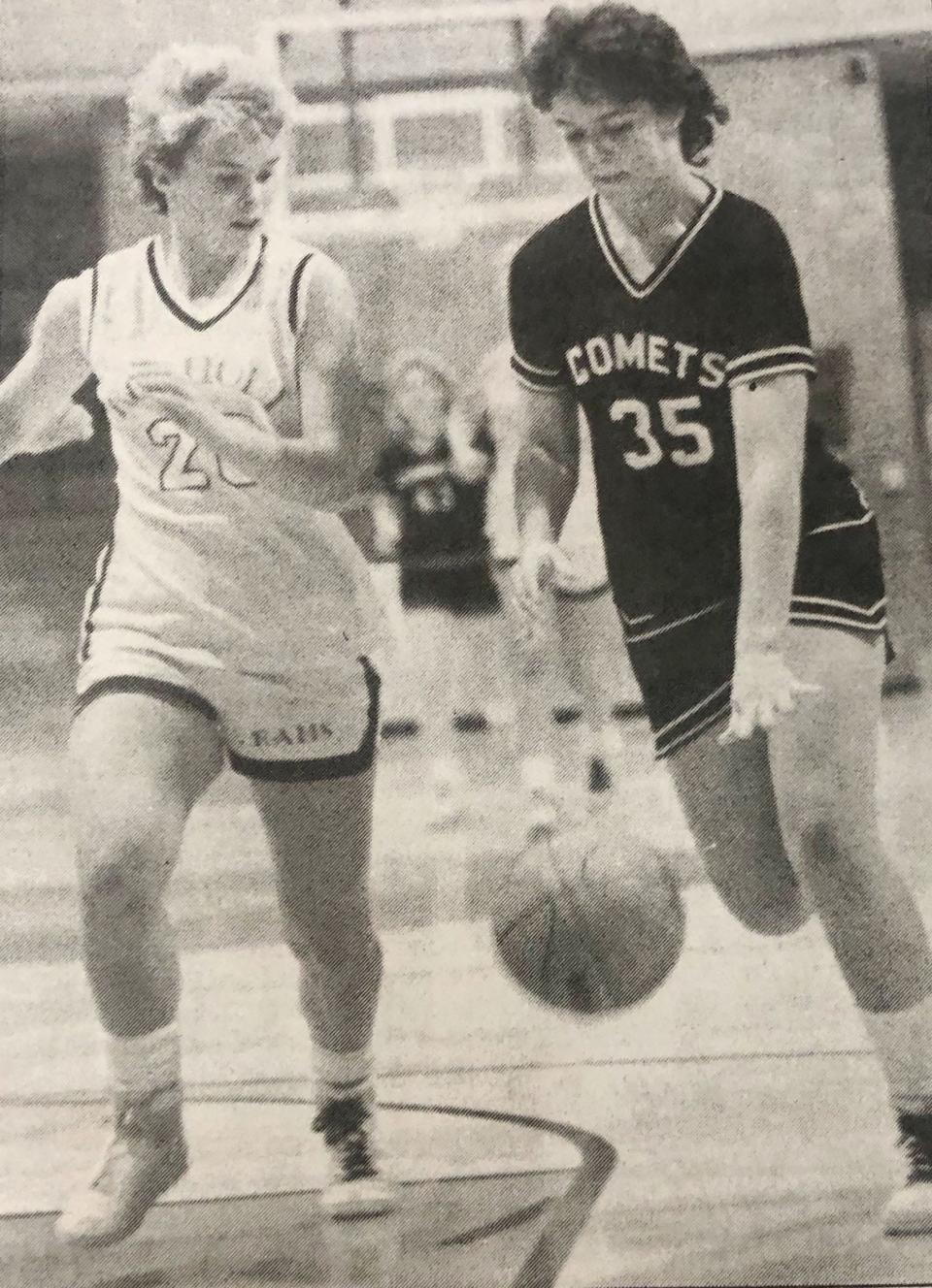 South Shore's Amy Nawroth (35) drives against Rosholt's Tami Madsen during the 1986 Region 1B girls basketball championship in Webster. Nawroth played with a sprained ankle late in the game but still scored 18 points to lead the Comets to a 51-47 overtime win.