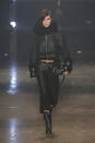 <p>Bella walked Versus Versace's first catwalk in London wearing a black bomber jacket and lace-up boots during London Fashion Week</p>