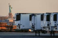 FILE PHOTO: Refrigerated tractor trailers used to store bodies of deceased people are seen at a temporary morgue in New York City