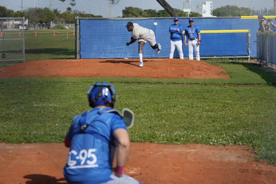 Pitcher Aroldis Chapman throws during practice with the Cuban Professional Baseball Federation (FEPCUBE), Tuesday, Jan. 16, 2024, in Miami. The team is a group of about 30 or so players, most of whom were born in Cuba and defected from their home island. They’re not affiliated with the Baseball Federation of Cuba (FCB), the sport’s governing body in Cuba, but were put together to field a team that represents the patriotic ideals of their people. (AP Photo/Lynne Sladky)