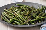 <p>Sesame oil and soy sauce lend these veggies Asian flair.</p><p><strong><a href="https://www.countryliving.com/food-drinks/recipes/a4563/skillet-green-beans-recipe-clx1113/" rel="nofollow noopener" target="_blank" data-ylk="slk:Get the recipe for Skillet Green Beans;elm:context_link;itc:0;sec:content-canvas" class="link ">Get the recipe for Skillet Green Beans</a>.</strong></p>