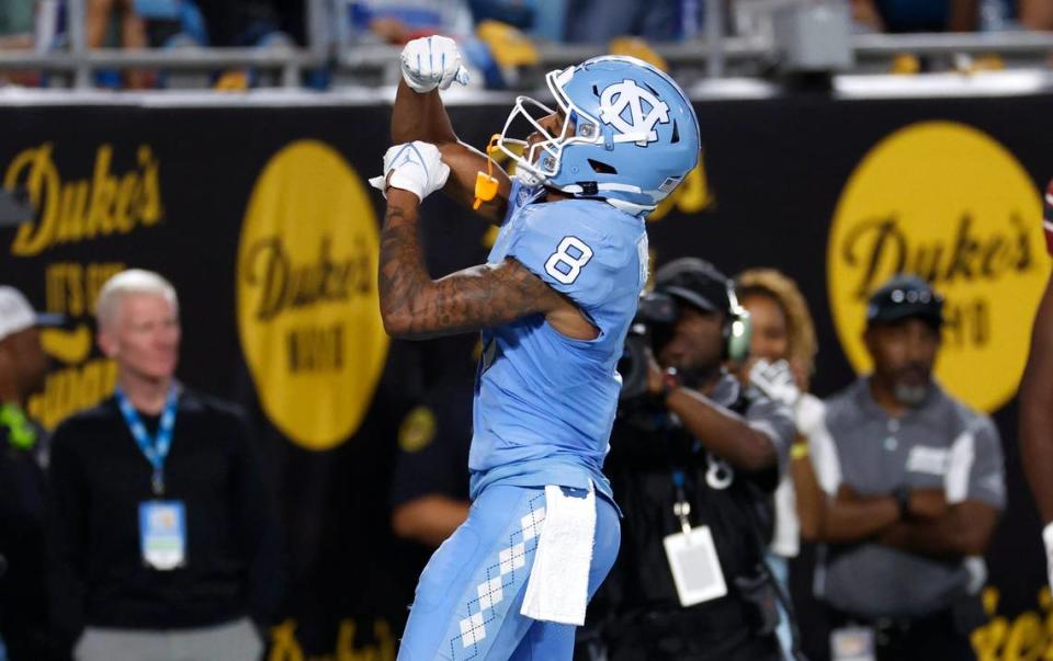 North Carolina wide receiver Kobe Paysour (8) celebrates a 34-yard touchdown reception during the first half of UNC’s game against South Carolina in the Duke’s Mayo Classic at Bank of America Stadium in Charlotte, N.C., Saturday, Sept. 2, 2023.