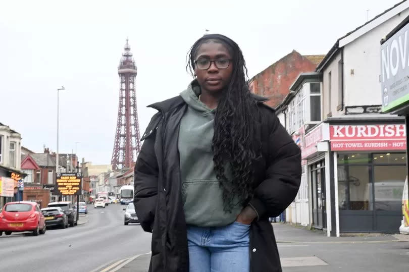 A photo of Jade Barnett standing in front of Blackpool Tower