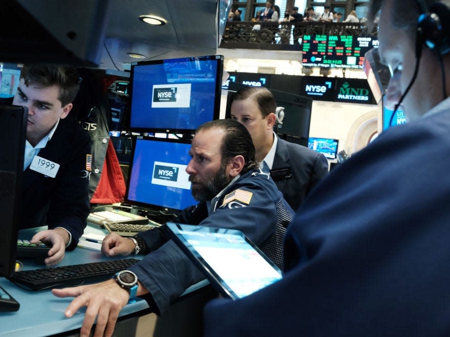 Traders on the floor of the New York Stock Exchange (NYSE)