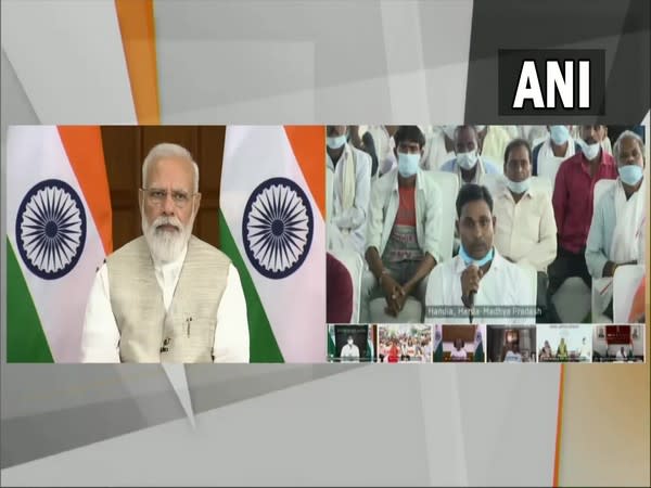 Prime Minister Narendra Modi interacting with beneficiaries of Svamitva scheme from Madhya Pradesh. (Photo/ANI)