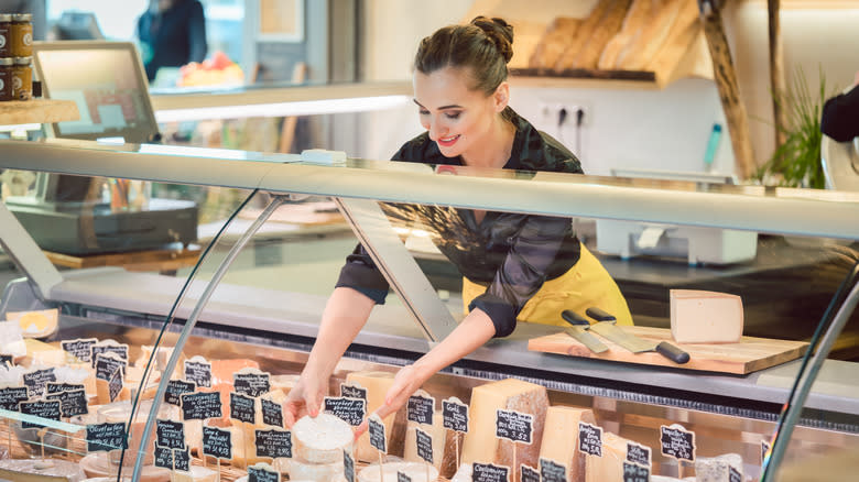 woman in deli cheese section