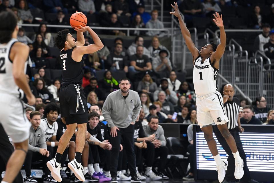 Jan 13, 2024; Providence, Rhode Island, USA; Xavier Musketeers guard Desmond Claude (1) shoots the ball over Providence Friars guard Jayden Pierre (1) during the first half at Amica Mutual Pavilion. Mandatory Credit:Eric Canha-USA TODAY Sports