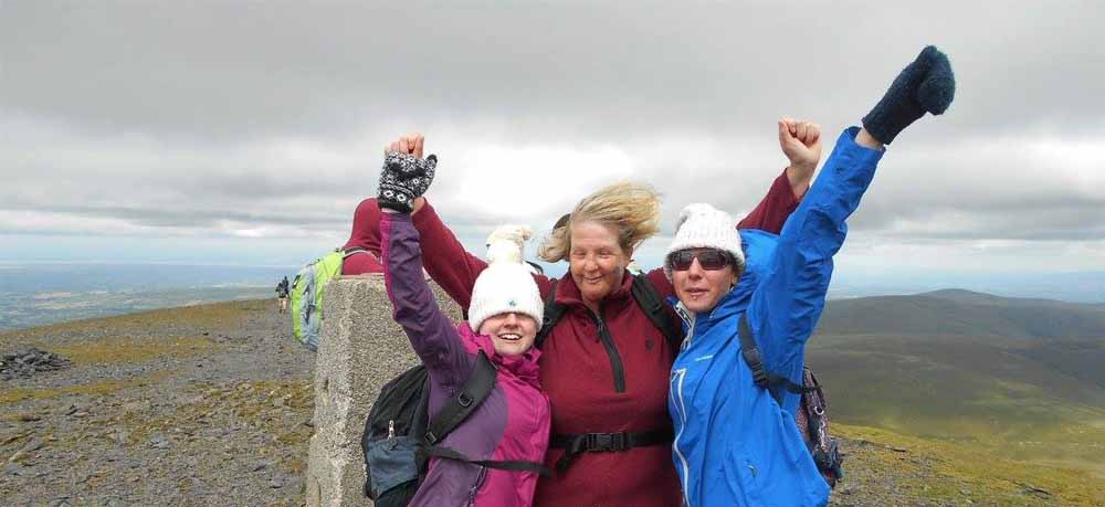 Lisa, Nicky and Michelle celebrate at the summit of Skiddaw (PA Real Life/Collect)