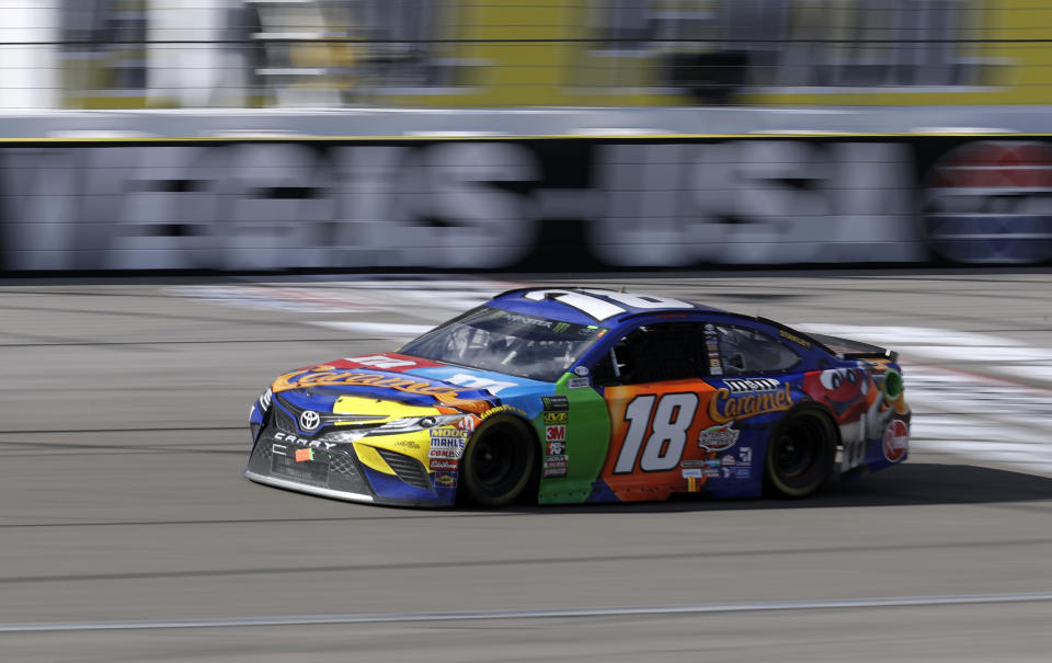 Kyle Busch crosses the start/finish line during a NASCAR Cup series auto race Sunday, March 4, 2018, in Las Vegas. (AP Photo/Isaac Brekken)